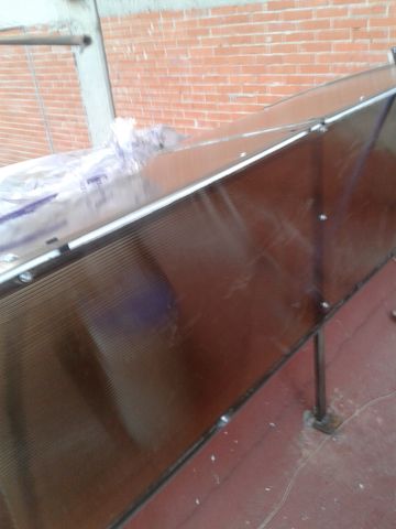faldones para evitar entrada de lluvia, de techo media luna color bronce